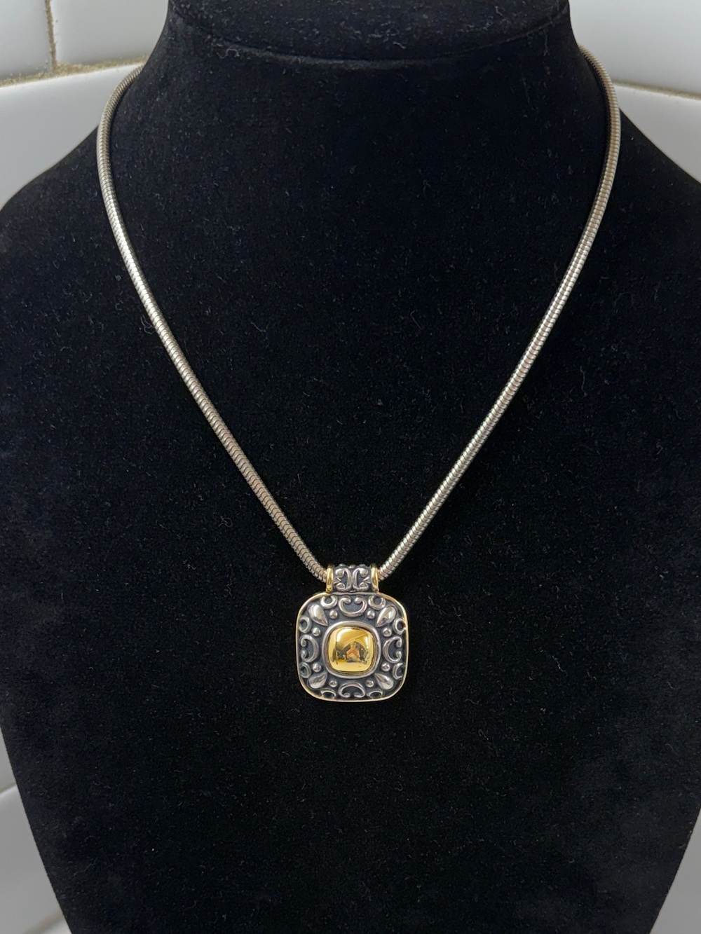 DOUGLAS PAQUETTE Silver and Gold Tone Pendant Necklace